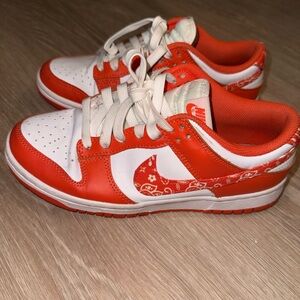 Nike Orange & White Low-Top Sneakers with Patterned Swoosh